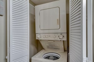 Stackable Washer and Dryer in Hall Bathroom