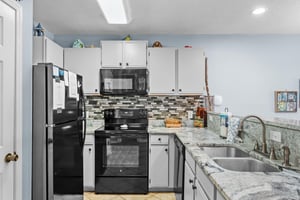 Kitchen Open to Dining and Living Areas