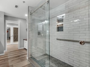 Double Walkin Shower with Dual Rainfall Showerheads in Primary Bathroom