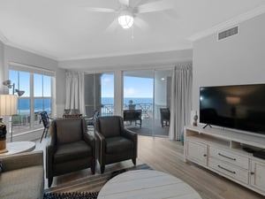 Living area with TV and balcony access