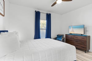 Primary Bedroom with Queen Bed and Flat Screen TV