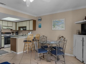 Dining area with additional seating at breakfast bar