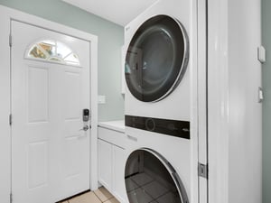 Washer and Dryer Off Kitchen with Access to Outside