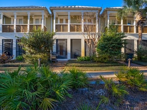 Screen porch provides access to beautiful courtyard