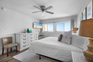 Primary bedroom with king bed and a view