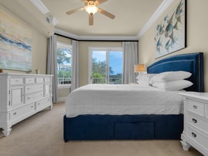 Primary bedroom with balcony access