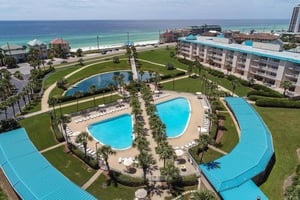 View of pool area, koi pond and Gulf of Mexico