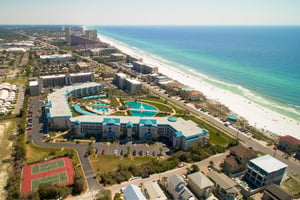 Arial of complex tennis beach acess and beach