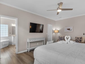 Primary Bedroom with Wall Mounted TV