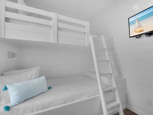 Bunk Room with Wall Mounted TV