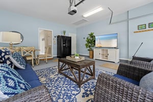 Garage Living Room with Fridge and TV