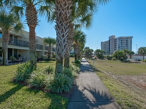 Courtyard walk way to beach and south pool area