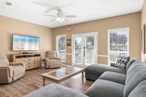 Spacious Living Room with Large Flat Screen TV