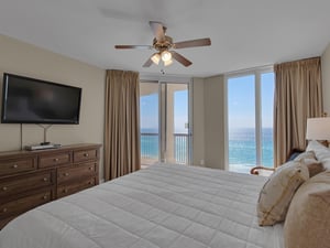 Primary Bedroom with Flat Screen TV and Access to Private Balcony