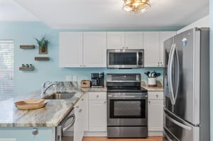 Fully Stocked Kitchen with Stainless Steel Appliances