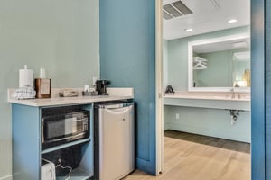 Kitchenette area with mini fridge, microwave and toaster