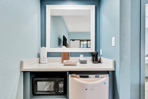 Kitchenette area with mini fridge, microwave and toaster