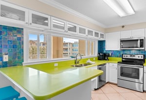 Vibrant Kitchen with Beach Views and Bar Seating