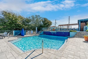 Spacious 1st level pool deck with peaceful water feature