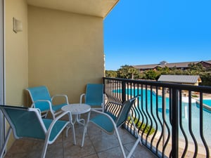 Private Balcony with Comfortable Seating and Pool View