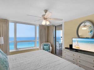 Flat Screen TV in Primary Bedroom with Balcony Access