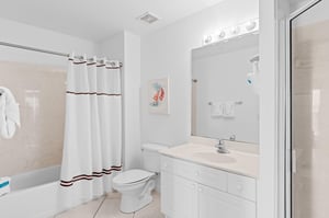 Primary Bathroom with Walk In Shower and Tub Shower Combo