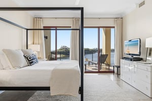 Bedroom 1 with King Bed and Private Balcony Access