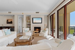 Living Room with Fireplace and Private Balcony Access