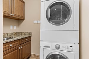 Your inunit laundry setup makes packing light a breeze, with granite countertops perfect for folding your fresh clothes.