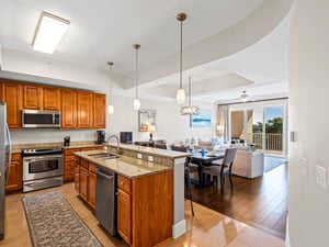 Kitchen flows seamlessly into the dining and living areas, creating the perfect space for memorable gatherings and relaxing evenings.