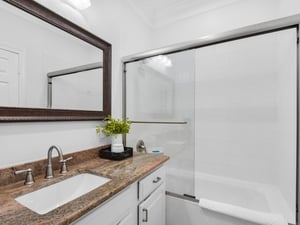 Guest Bathroom in Hallway with Tub Shower Combo