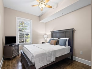 Bedroom 3 Unwind in your serene bedroom with gentle ceiling fan breeze, and natural light through shuttered windows.