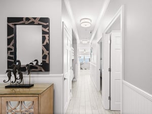 Step into your private hallway where elegant details and coastal touches create a welcoming first impression for your beach getaway.