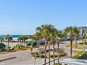 Gulf views and palmlined streets create a perfect coastal neighborhood setting just steps from the beach.