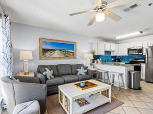 Relax in the bright, openconcept living space where coastal charm meets modern comfort with a fully equipped kitchen.