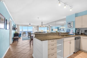 Your oceanfront kitchen island becomes command central for vacation meals, with granite counters and sea views streaming through floortoceiling windows.