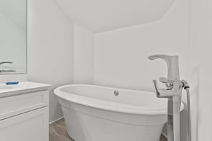 Sink into this elegant freestanding tub for a luxurious soak after your adventures, complete with sleek modern fixtures.