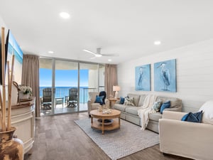 Relax in your bright living room with stunning ocean views through floortoceiling windows opening to your private balcony.
