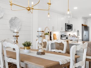 Your bright coastal dining space flows seamlessly into the fully equipped kitchen, perfect for hosting memorable meals together.