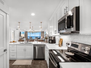 Your dream kitchen awaits with sparkling countertops, stainless steel appliances, and ocean views that make every meal magical.