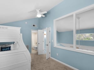 Sink into coastal comfort in this oceaninspired bedroom with builtin bunks and peaceful blues that invite sweet dreams.