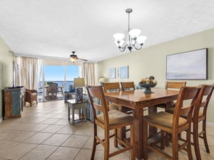 Gather around your elegant dining table for memorable meals with ocean views streaming through your private balcony doors.