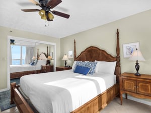 Sink into your kingsize fourposter bed with ocean views peeking through the doorway, warmed by gentle ceiling fan breezes.