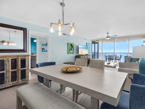 Gather around your spacious dining table for memorable meals with ocean breezes flowing through floortoceiling windows and endless sea views as your backdrop.
