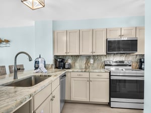 Your fully equipped kitchen awaits with granite countertops, stainless appliances, and everything needed for homecooked meals during your stay.