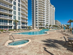 Modern resortstyle complex featuring 2 swimming pools, hot tub and spacious pool deck.
