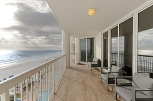 Sip your morning coffee on this expansive oceanfront balcony, where endless beach views and gentle waves create your perfect peaceful retreat.