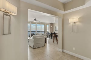 Step into your elegant coastal retreat where ocean views frame the open living space, perfect for relaxing after beach days.