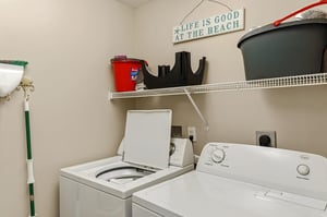Your private laundry room keeps beach clothes fresh with fullsize washer and dryer, plus storage for all your essentials.