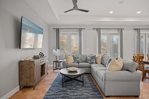 Sink into the plush sectional sofa and unwind in the bright, airy living room